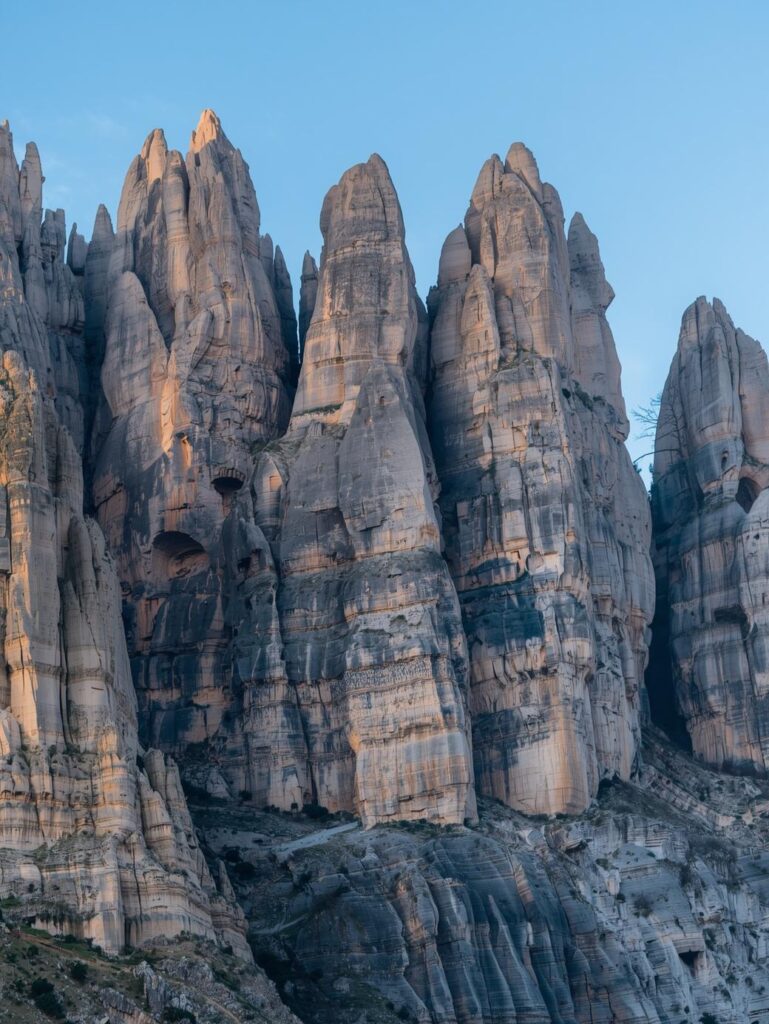 located in northern italy, the dolomites are known for their unique rock formations and dramatic vertical cliffs